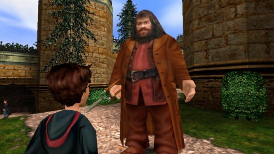 Hogwarts Legacy looks to "honour" the Harry Potter games of old: A pixelated Harry Potter looks up at a blocky Hagrid in Hogwarts Grounds