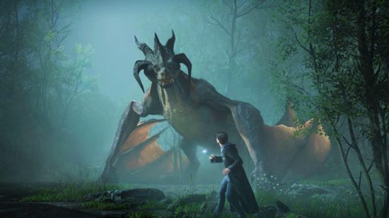 Hogwarts Legacy preview - A young boy in a black cloak rimmed with blue stands in front of a hulking dragon in a misty forest