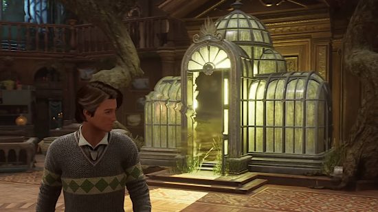 Hogwarts Legacy Room of Requirement - a wizard is walking in front of the Vivarium, which is a greenhouse-like structure in the Room of Requirement.