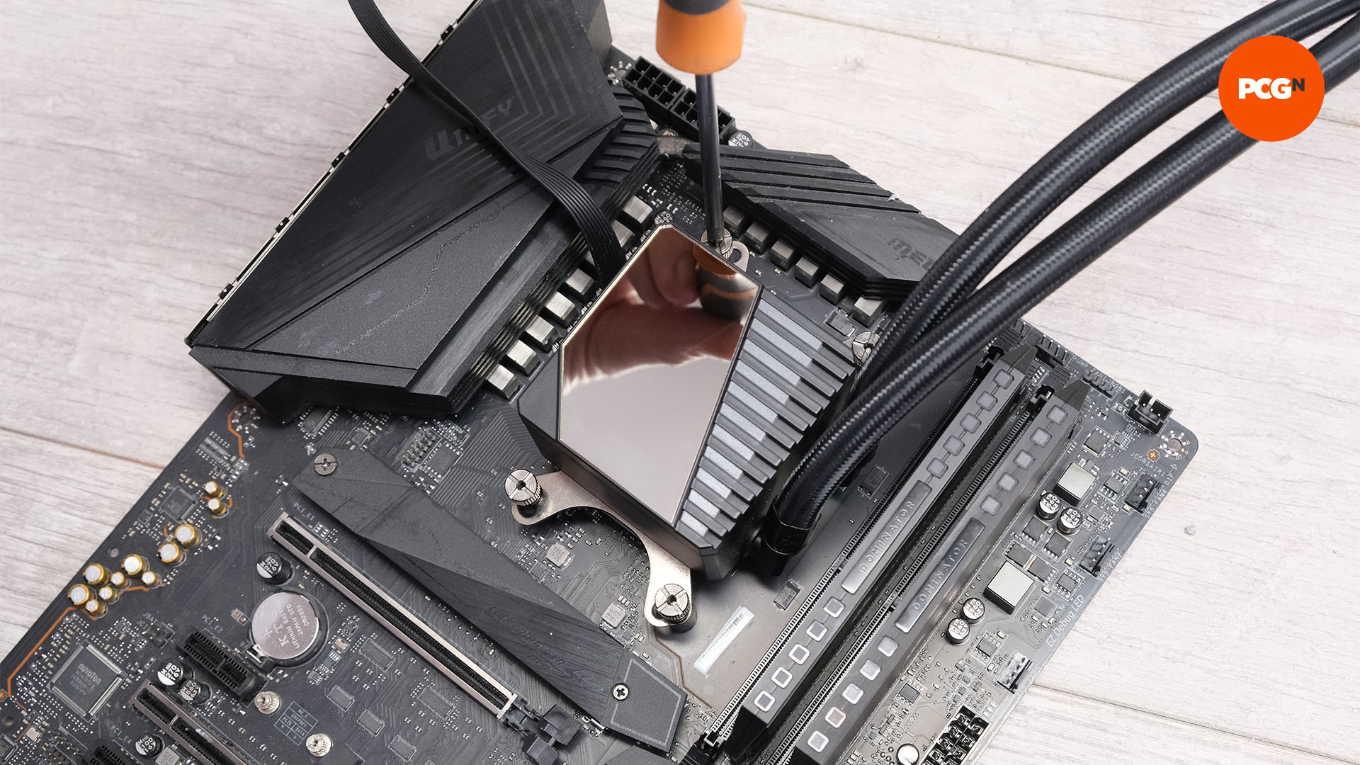 The AIO pump is screwed into the mounts on the motherboard