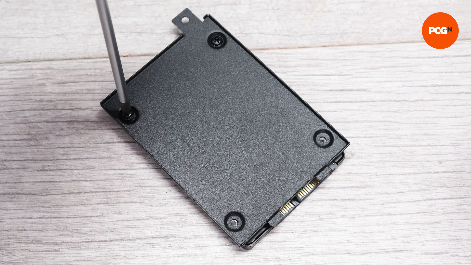 The SSD is mounted to its plate for the new gaming PC