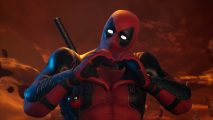 Marvel's Midnight Suns Deadpool DLC: Deadpool makes the shape of a heart with his hands, trying to be cute