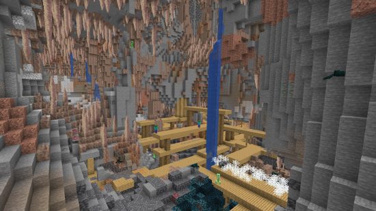 Large Minecraft dripstone caves interlock with a mineshaft and deep dark.