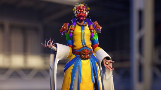 Overwatch 2 Lunar New Year Event: Moira Mask Dancer Legendary Skin zoals afgebeeld in de Hero Gallery, met Moira in kleurrijke gewaden en met een traditioneel masker.