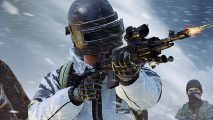 PUBG map redesign blends core battle royale game with fresh energy. A soldier in a heavy metal mask fires an assault rifle during a blizzard in battle royale game PUBG