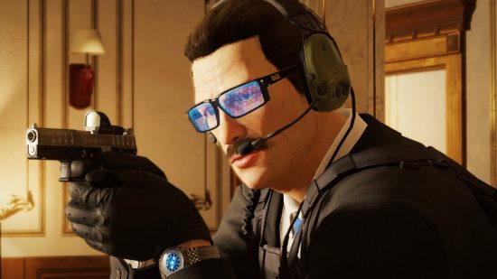 Rainbow Six movie gets John Wick director, Black Panther star. A man in glasses with a moustache, Warden from Rainbow Six Siege, aims a handgun