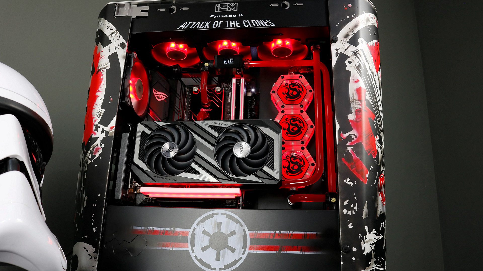 Custom Star Wars gaming PC with red parts, vertical AMD graphics card and "Attack of the Clones" written on top