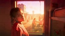 Upcoming games on PC: a woman stands next to a window in her jailcell, bathed in orange sunlight.