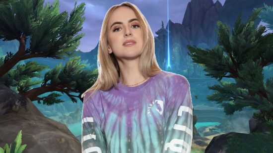 WoW Dragonflight feels "free," Twitch streamer and MMO star Eiya says: A blonde woman wearing a tie dye long sleeved shirt in blue and lavender on a forest background with mountains and a blue lake