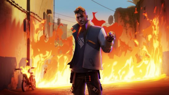 Valorant players don’t need help against high-ping, they need servers: A black man in a white high necked jacket and black combat jeans stands in front of a raging fire smiling menacingly