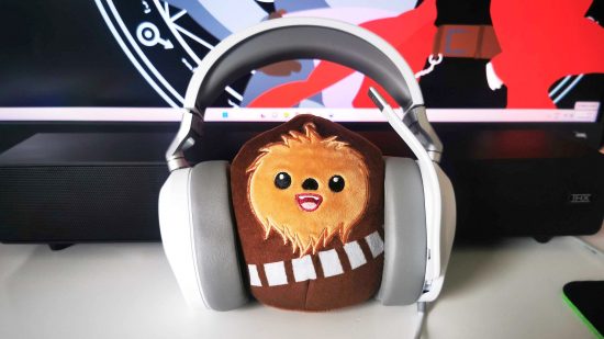 Best gaming headset 2023: Corsair HS65 Surround with plush Wookie in centre