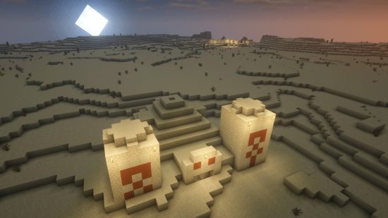 Minecraft seeds: A desert temple in the foreground, with a desert village on the horizon.