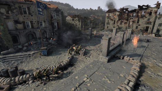 Company of Heroes 3 review: Soldiers fighting in a muddy ruined town behind sandbags