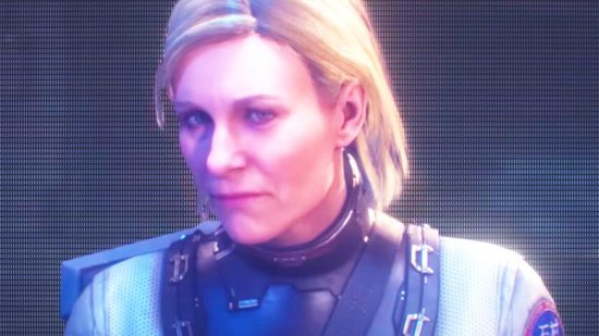 Dead Space Remake sequels: A scientist with blonde hair, Nicole from Dead Space, stares ominously