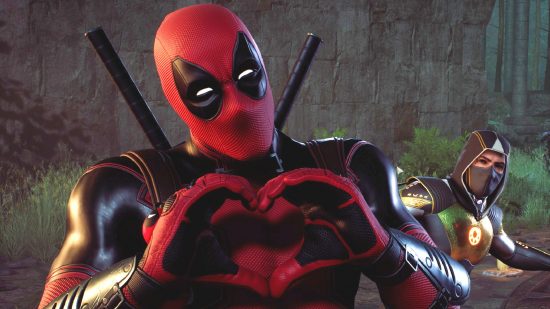The superhero Deadpool, makes a heart sign with his hands