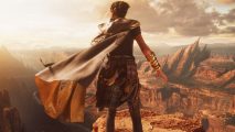 The Forspoken map is basically Manhattan, helping Frey feel at home: A young black woman with her hair in a bun stands above a huge canyon facing away from the camera as the wind blows her grey cloak