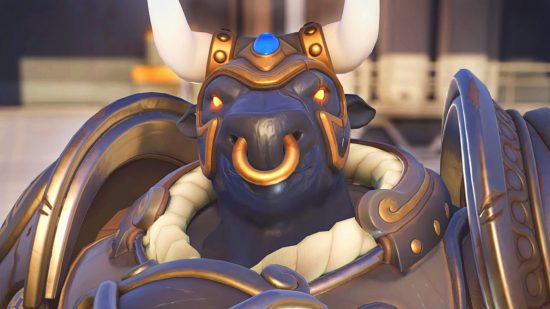 Overwatch 2 balance - Reinhardt in his Minotaur skin, with a bull face, golden nose ring, and gold helmet with large horns