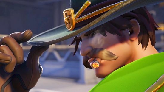 Overwatch 2 reworks - Cassidy, a cowboy with a moustache, tips his green ranger hat as he puffs on a cigar