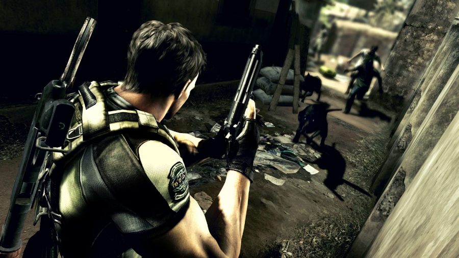 Resident Evil 5: A man holding a gun above his shoulder stares down enemies in Capcom horror game RE5