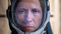 Here's the very best deal to buy Returnal on PC: a woman in a space suit looks into the camera in a close up, through the glass of her helmet