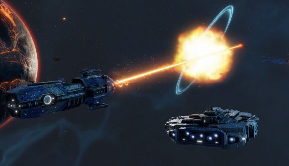 Sins of a Solar Empire 2 multiplayer: A large, dark-blue capital frigate fires a white-hot beam of energy at another ship, blowing it up in a massive explosion that is sending a blue energy ring out from the point of detonation