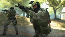 Why Counter-Strike 2 needs a progress bar (and why you'll love it): A man in military combat gear readies his rifle in a park setting with another soldier in the background