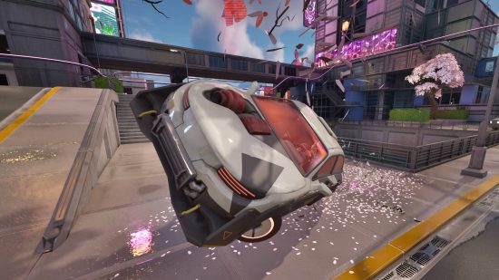 Fortnite Nitro Drifter how to drift - a white sports car is obliterating a pink cherry blossom tree in the middle of Mega City.