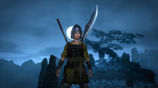 Wo Long: Fallen Dynasty review - the player character is standing near a lone tree, surrounded by rocks and lit by moonlight.