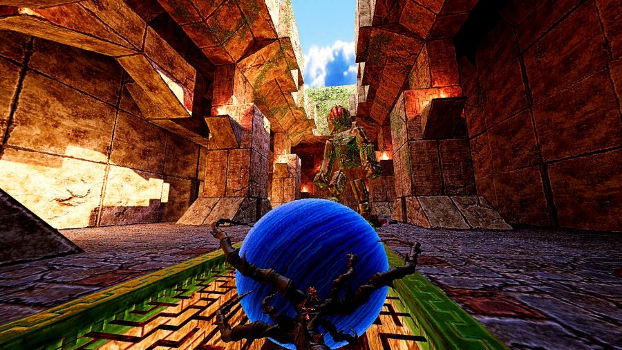 Amid Evil - first-person screenshot where the player is aiming a four-pronged claw with a glimmering blue orb in the centre at a large stone figure covered in vines, which stands in a vast open-air temple