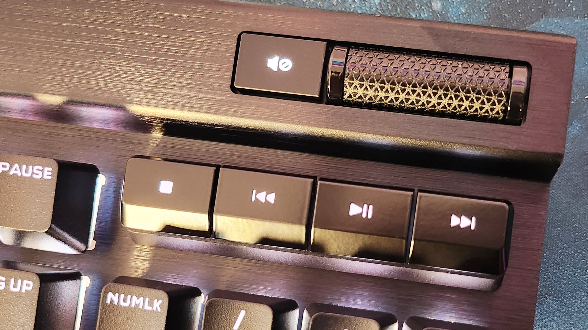 Corsair K70 RGB Pro review: A close up of a gaming keyboard, highlgihting its media key and volume wheel