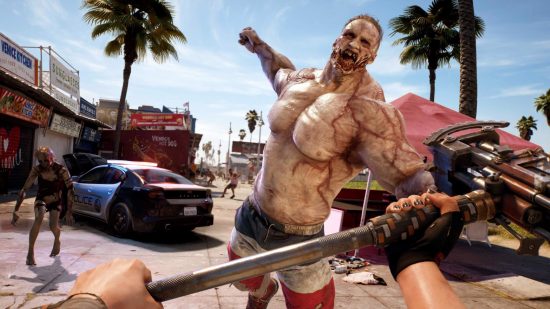 Dead Island 2 gameplay preview: A huge, muscular zombie throws a punch at the player, who is holding a large, hammer.