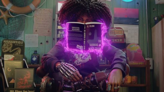 Redfall might be "slow," but that's how Arkane likes it: A black woman with an afro and gothic-style clothing with silver jewellery sits with her legs crossed reading a floating book surrounded by purple energy on a counter