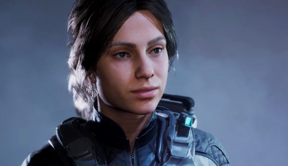 Divisive Scars Above is already on Steam sale, so get it quick: A white woman with brown hair in a ponytail wearing a combat space suit looks off into the distance