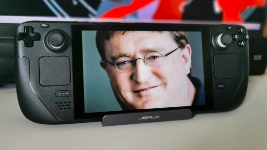 Steam Deck on stand with Gabe Newall's face on screen