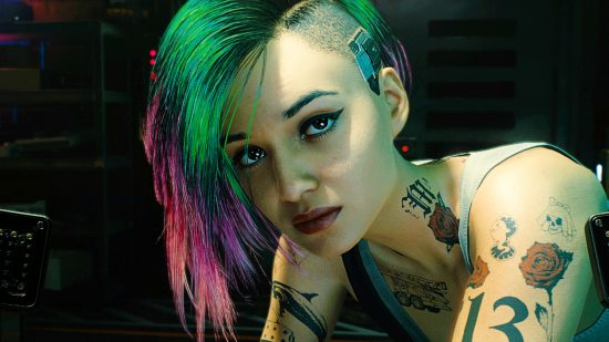 Steam Spring Sale 2023 - Judy from Cyberpunk 2077, a tattooed woman with green and pink hair and a shaved undercut
