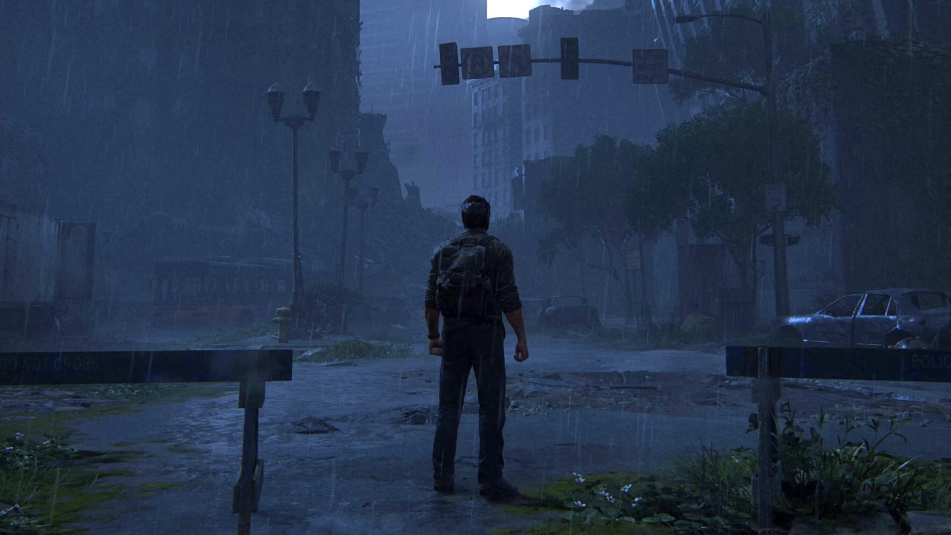 The best Last of Us settings: Joel standing in rainy cityscape