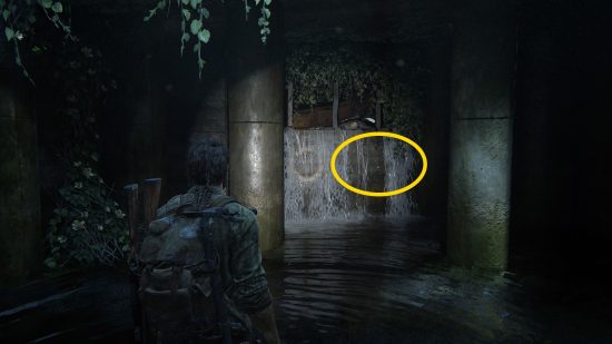 The Last of Us Firefly Pendants locations: a man, knee-deep in water, shines his flashlight in a dark room.