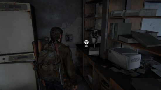 The Last of Us Firefly Pendants locations: a man looks at a shelf in a dark room.