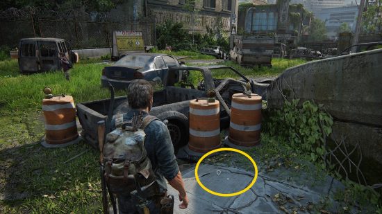 The Last of Us Firefly Pendants locations: a man stands on an overgrown, abandoned street.