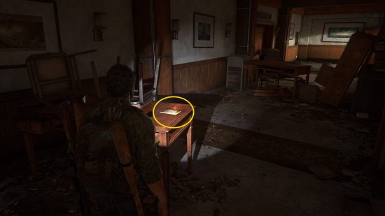 The Last of Us training manuals: a man finds a book on a table.
