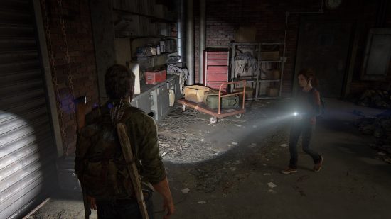 The Last of US workbench tool locations: a dark room, with a man and a young woman searching for supplies.