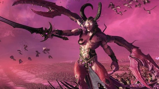 Total War Warhammer 3 is a free game on Steam, for now: A demonic woman with black curving horns and a huge sword extends it in front of her commanding an army of demons against a deep pink sky