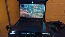The Acer Pedator Helios 3D 15 SpatialLabs Edition gaming laptop displaying game capture from Kena: Bridge of Spirits
