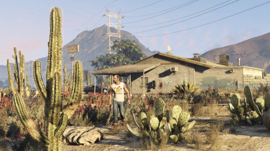 Trevor is wandering outside his house in the desert, presumably in an effort to activate some GTA 5 cheats.