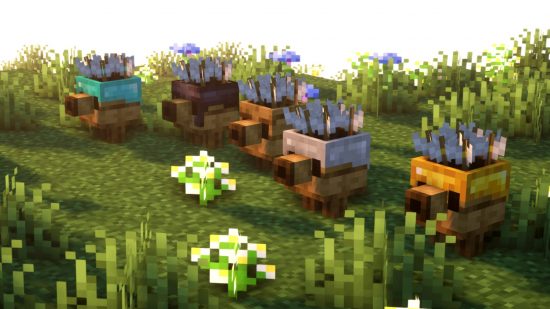 Five plank golems from Max's Miny Golems, one of the best Minecraft mods, stand in a row surrounded by flowers and grass.