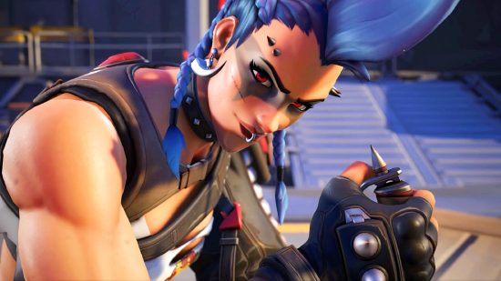 Overwatch 2 hero complexity - Junker Queen looks up wryly at you, her arm muscles flexing as she plants her knife Gracie into a table top