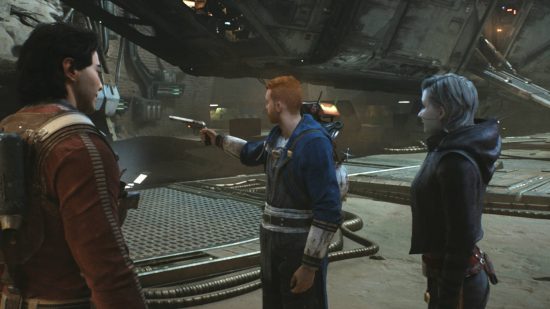 Star Wars Jedi Survivor Jedha - Cal is pointing a blaster he's just received from an ally. The other two look on as he points it away from them.