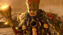 Total War Warhammer 3 Chaos Dwarfs DLC review: An angry dwarf wearing a red Pope-like hat and a necklace of teeth and skulls roars on a battlefield holding a torch
