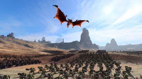 A tattered red dragon creature flies over an army of hobgoblins fighting chaos dwarfs in a wilderness setting