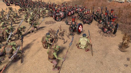 An army of hobgoblins facing off against legions of Chaos Dwarfs in a sandy setting